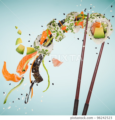 Pieces of delicious japanese sushi frozen in the air. Isolated on pastel blue background 96242523