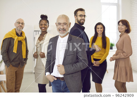 Multiracial business team with senior boss forefront 96242909