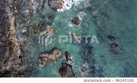 A lot of boulders in the sea. Coastal cliffs of the North Atlantic. Seaside beautiful nature. Dramatic seascape of the north of Europe. Aerial photo. Drone point of view. A lot of boulders in the sea. Coastal cliffs of the North Atlantic. Seaside beautiful nature. Dramatic seascape of the north of Europe. Aerial photo. Drone point of view. 96243188