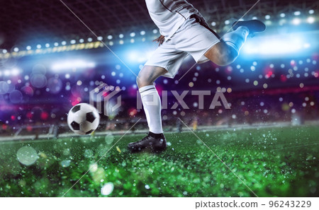 Soccer player ready to kick the soccerball at the stadium during the match. Soccer player ready to kick the soccerball at the stadium during the match. 96243229