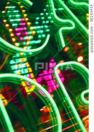 Neon abstract background. Glowing sign on the window in the city Neon abstract background. Glowing sign on the window in the city 96243414