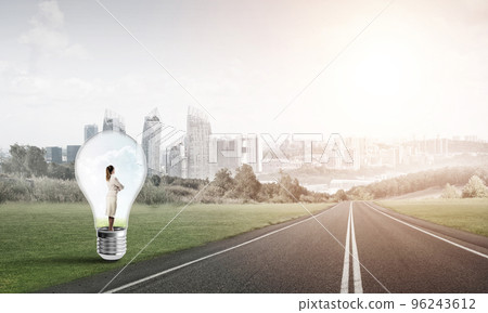 Businesswoman inside light bulb 96243612