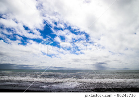 Waves crashing on the shore and sky scenery Waves crashing on the shore and sky scenery 96243736