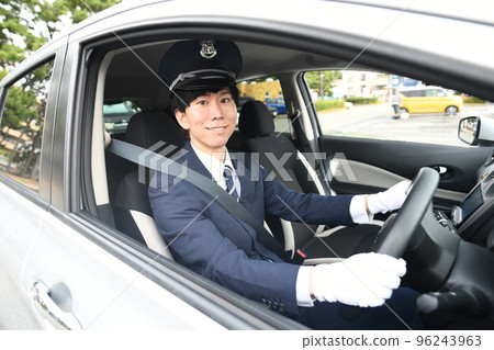 Male driver driving a taxi 96243963