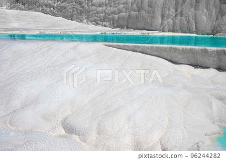 View of natural travertine pools and terraces in Pamukkale. Cotton castle in southwestern Turkey View of natural travertine pools and terraces in Pamukkale. Cotton castle in southwestern Turkey 96244282