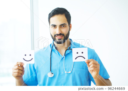 Doctor holding a card with symbol Smile, Medical concept Doctor holding a card with symbol Smile, Medical concept 96244669