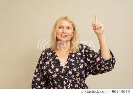 I have it eureka. Excited enthusiastic creative cute european woman raise index finger, found great solution suggest perfect plan. He is standing on beige background excited to give some good advice. I have it eureka. Excited enthusiastic creative cute european woman raise index finger, found great solution suggest perfect plan. He is standing on beige background excited to give some good advice. 96244670