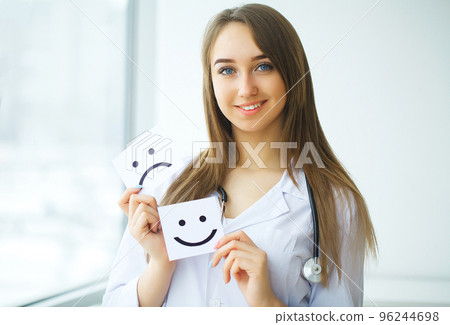 Doctor holding a card with symbol Smile, Medical concept 96244698