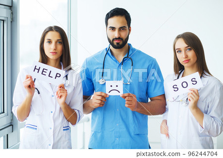 Doctor holding a card with Symbol Smile. Help and Sos, Medical concept 96244704