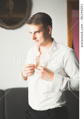 Beautiful man, groom posing and preparing for wedding 96244891