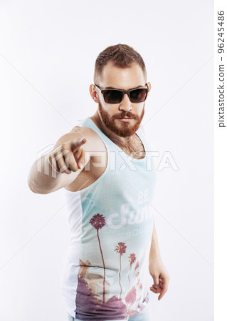 Hipster bearded redhead guy pointing index finger the front of him to the camera on white background Hipster bearded redhead guy pointing index finger the front of him to the camera on white background 96245486