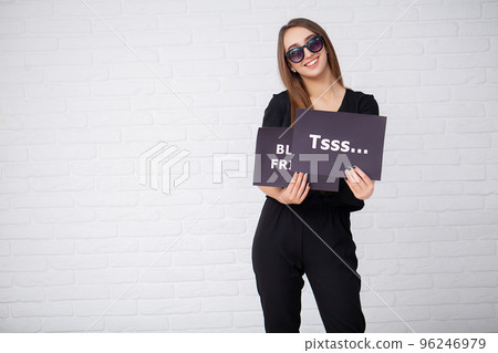 Women holding discount blanks on ligth background in black friday holiday Women holding discount blanks on ligth background in black friday holiday 96246979