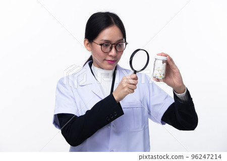 Half body face 30s 40s Asian Woman Pharmacist Doctor, wear formal lab Coat. Smile Hospital female hold magnifying search investigate find out drug pill detail over white background isolated 96247214