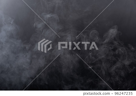 Dense Fluffy Puffs of White Smoke and Fog on black Background, Abstract Smoke Clouds, Movement Blurred out of focus. Smoking blows from machine dry ice fly fluttering in Air, effect texture 96247235