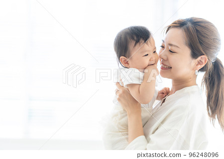 A mother holding a baby A mother holding a baby 96248096