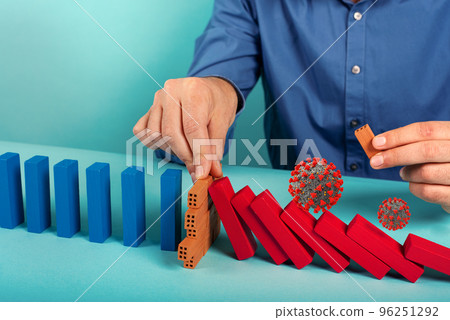 Concept of covid19 coronavirus pandemic with falling chain like a domino game. Contagion and infection progression stopped by a hand of a doctor. Cyan background 96251292
