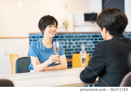 Men and women toasting at lunch Men and women toasting at lunch 96251789