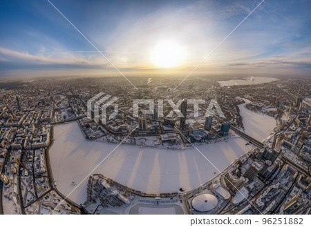 Yekaterinburg city with Buildings of Regional Government and Parliament, Dramatic Theatre, Iset Tower, Yeltsin Center, panoramic view at winter sunset. 96251882