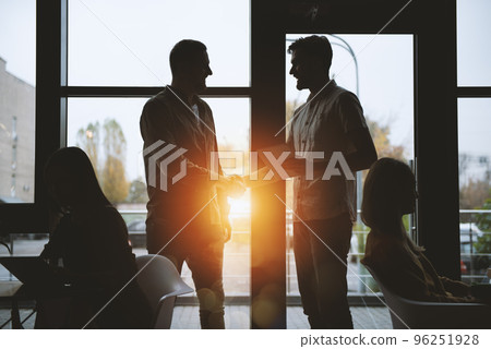 Handshaking business person in office. concept of teamwork and partnership. Handshaking business person in office. concept of teamwork and partnership. 96251928