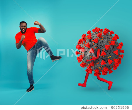 African-American man fighting with bare hands against a big virus on cyan background 96251996