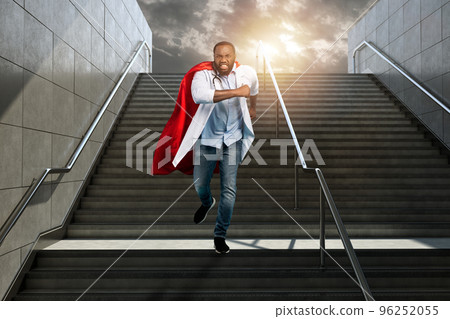 Medic acts like a superhero in hospital to fight pandemic of covid19 coronaviruses. Blue background 96252055