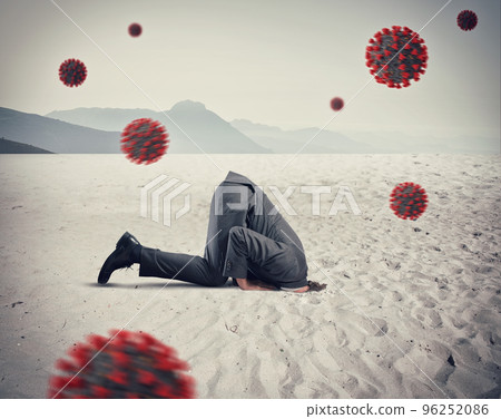 Man hides himself like an ostrich due to coronavirus covid19 problem in the air 96252086