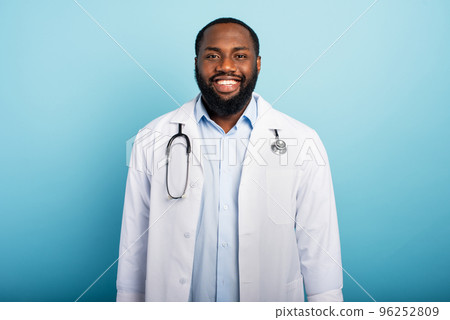 Doctor is happy because the emergency of coronavirus covid-19 are finishing. Light blue background 96252809