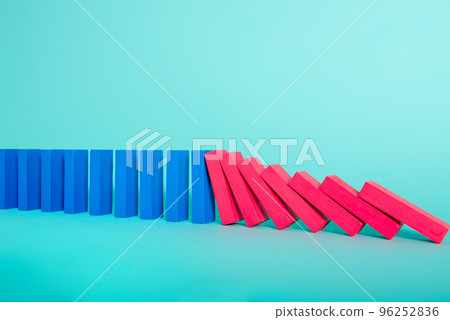 Concept of covid19 coronavirus pandemic with falling chain like a domino game. Contagion and infection progression. Cyan background Concept of covid19 coronavirus pandemic with falling chain like a domino game. Contagion and infection progression. Cyan background 96252836