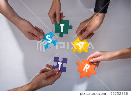 Teamwork of partners. Concept of integration and startup with puzzle pieces 96252886