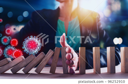 Businesswoman stops a chain fall by viruses like domino game. Concept of preventing crisis and failure in business. 96252910