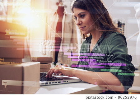 Seamstress works to new clothes ordered by internet client Seamstress works to new clothes ordered by internet client 96252976