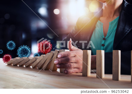 Businesswoman stops a chain fall by viruses like domino game. Concept of preventing crisis and failure in business. Businesswoman stops a chain fall by viruses like domino game. Concept of preventing crisis and failure in business. 96253042