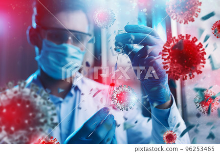 Medic with mask works on a solution for covid 19 virus. Concept of medical research Medic with mask works on a solution for covid 19 virus. Concept of medical research 96253465