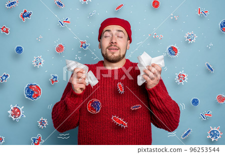 Boy caught a cold and is surrounded by viruses and bacteria. Studio on Cyan background 96253544