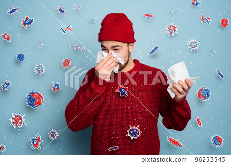 Boy caught a cold and is surrounded by viruses and bacteria. Studio on Cyan background 96253545