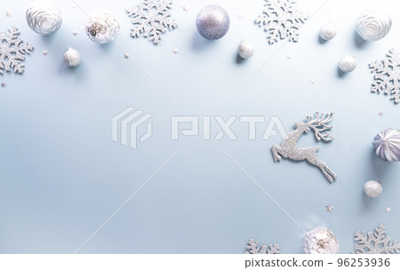 Christmas and new year background concept. Top view of Christmas star and snowflake on pastel blue background. Christmas and new year background concept. Top view of Christmas star and snowflake on pastel blue background. 96253936