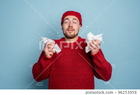 Boy caught a cold and has cold chills. Studio on Cyan background Boy caught a cold and has cold chills. Studio on Cyan background 96253958