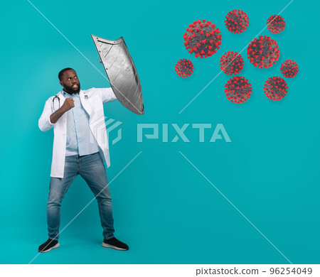 Doctor with shield fighting the sars cov virus 2 on cyan background 96254049