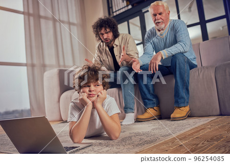 Father get angry and scold his son because he is internet addicted Father get angry and scold his son because he is internet addicted 96254085