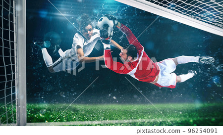 Soccer striker hits the ball with a head shot in the air at the stadium 96254091