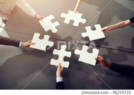 Teamwork of partners. Concept of integration and startup with puzzle pieces 96254729