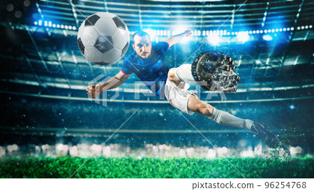 Soccer striker hits the ball with an acrobatic kick in the air at the stadium Soccer striker hits the ball with an acrobatic kick in the air at the stadium 96254768