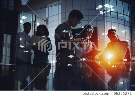 Businessmen that work together in office with network connection effect. Concept of teamwork and partnership. double exposure 96255271