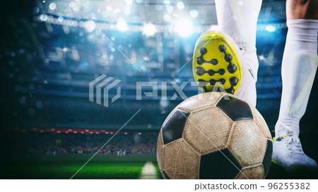 Close up of a soccer striker ready to kicks the ball at the stadium 96255382