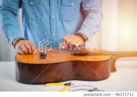 restring classical guitar restring classical guitar 96255712