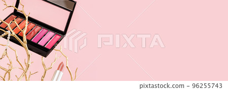Tender pink feminine makeup tools and accessories. brushes blush lipstick pearls on golden tree branches on candy pink. Birthday beauty cosmetics blogger advert banner concept. 96255743