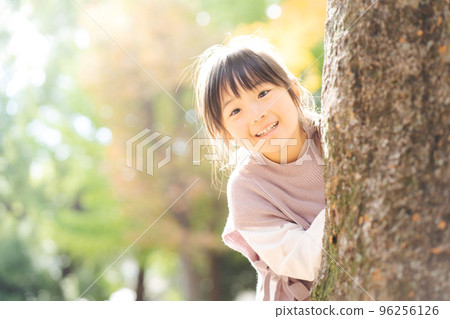 Girl playing hide and sees Girl playing hide and sees 96256126