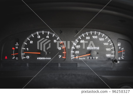 Front view of main dashboard with speedometer and tachometer in a used car Front view of main dashboard with speedometer and tachometer in a used car 96258327