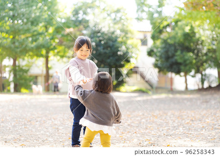 Sisters playing with each other Sisters playing with each other 96258343