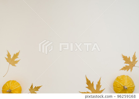 Creative top view flat lay autumn composition. Frame from dried pumpkin leaves on a beige background with copy space. Template autumn harvest, thanksgiving, halloween, invitation cards, autumn Creative top view flat lay autumn composition. Frame from dried pumpkin leaves on a beige background with copy space. Template autumn harvest, thanksgiving, halloween, invitation cards, autumn 96259168
